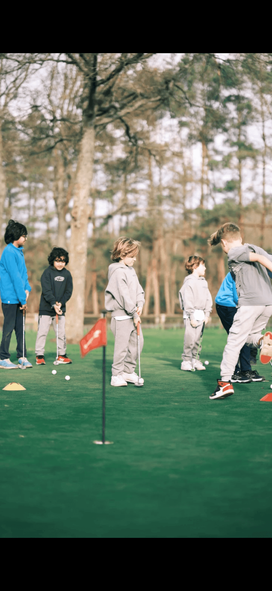 Juniors on a putting green